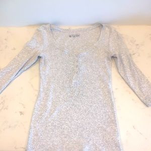 Sexy, sparkly fitted ribbed tee with silver embellishments.